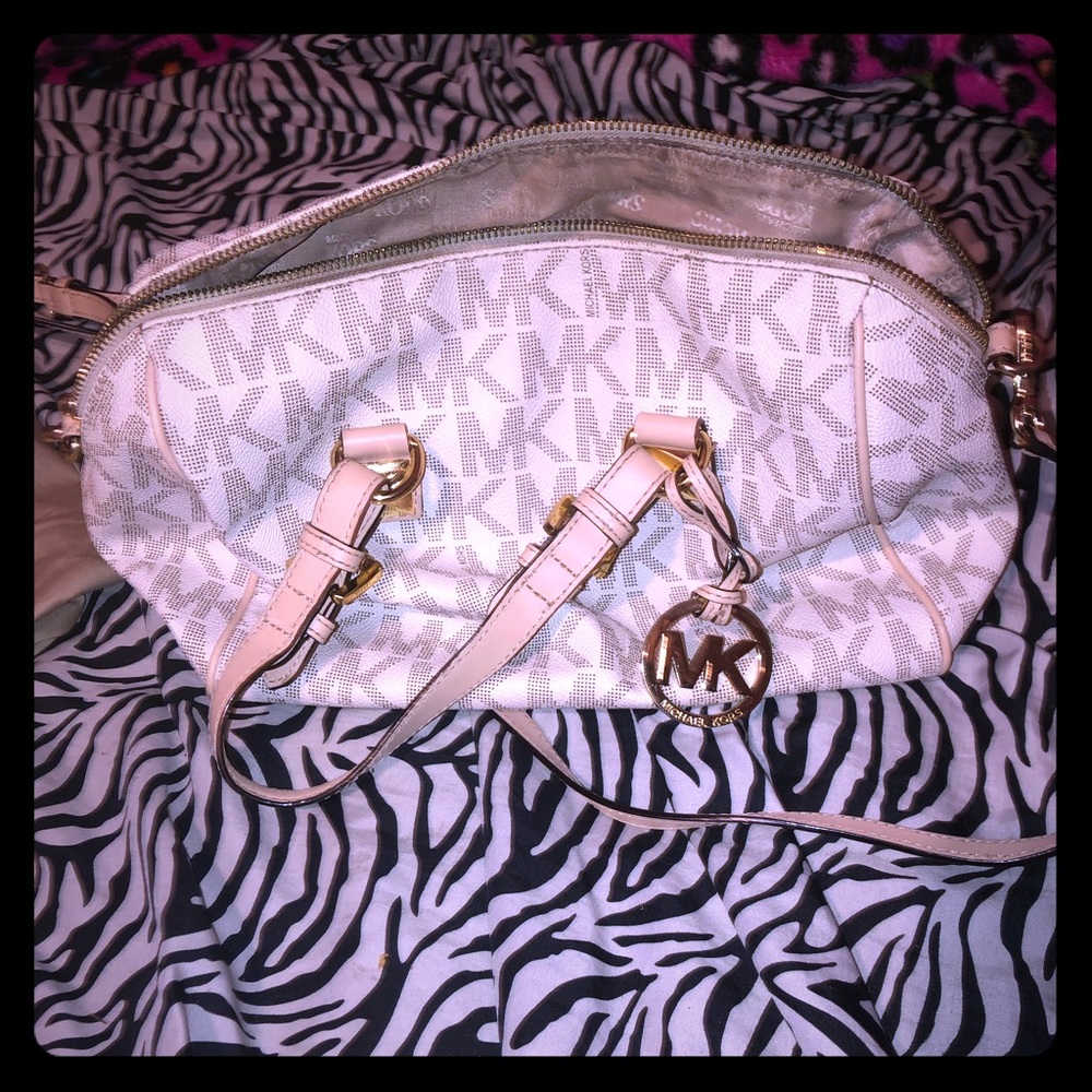 Mk bag needs some cleaning little stain on back